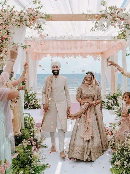 A perfect walk to remember. This is the moment every couple dreams of, and I make sure to capture it in all its glory, with family cheering and the ocean witnessing their union. This shot from a destination wedding in Thailand shows the joy and grandeur I bring to your big day.