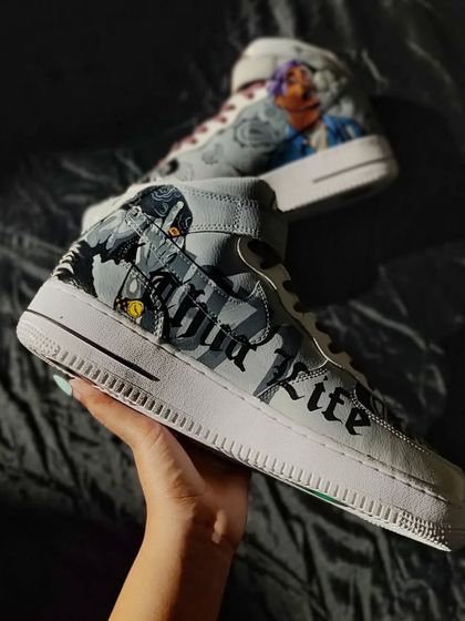 A side view of the Tupac custom, showing the "Thug Life" lettering. The grey and black color scheme gives it a gritty, vintage feel.