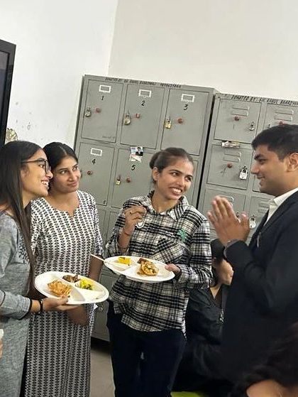 Interacting with my colleagues during the celebration. These informal chats are where we truly connect.