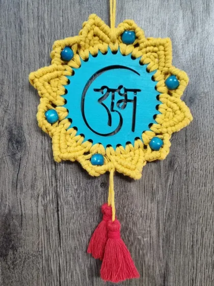 My 'Shubh Labh' wall hanging, a traditional symbol of good fortune. This piece, with its vibrant yellow and turquoise, makes a perfect housewarming gift or festive door hanging.