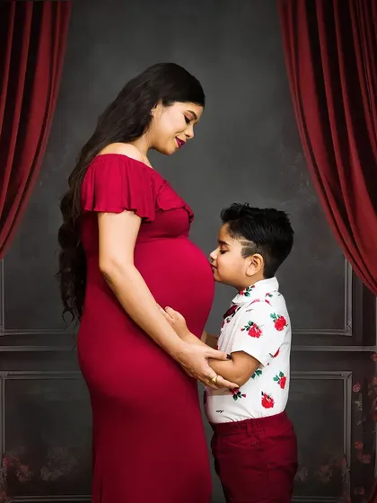 Welcoming a new baby is a family affair. I love capturing moments like this, where an older sibling connects with the baby bump. It’s a beautiful way to document your family's growing love story.