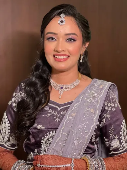A smiling portrait of the bride, looking happy and radiant.