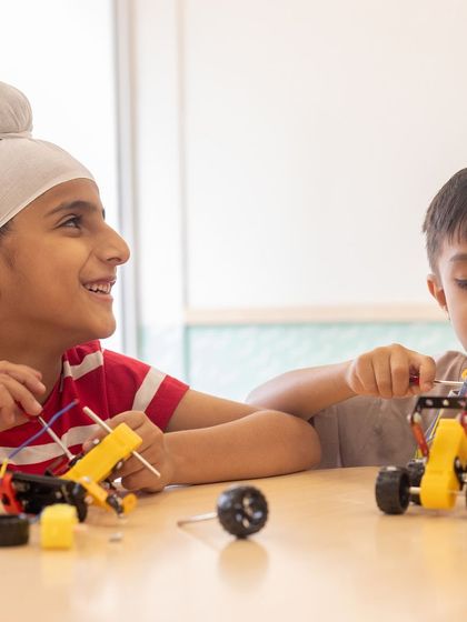 Friendship and teamwork are at the heart of our robotics classes. Here, Ishkabir and Ahaan collaborate on their project, learning that creating cool bots is even better when done together.
