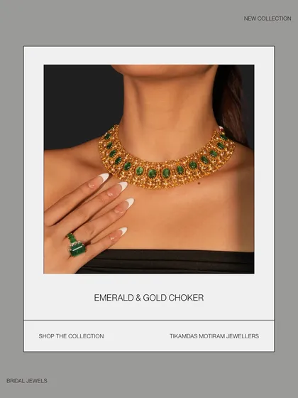 A catalogue-style shot of the emerald and gold choker, highlighting its intricate design and modern appeal.