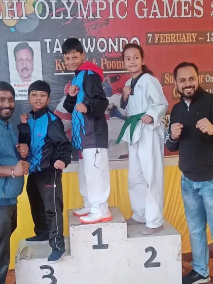 A proud group photo with our sub-junior medalists at the Delhi Olympic Games. We are there to cheer for our students at every event.