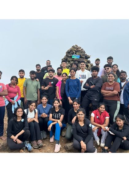 The mighty Kumara Parvatha team photo at the summit. Completing this trek together creates a special bond and a shared sense of achievement.