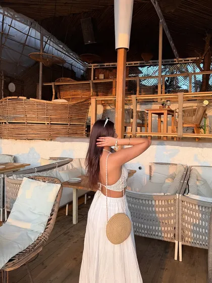 A back view of the outfit, showing the open-back detail.