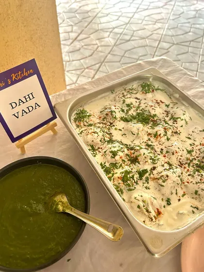A tray of delicious Dahi Vada, freshly prepared and garnished, ready to be added to the buffet line for a Republic Day brunch.