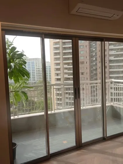 A recently installed Eternia sliding door. These aluminium doors are perfect for balconies, providing a wide opening and a sleek look.