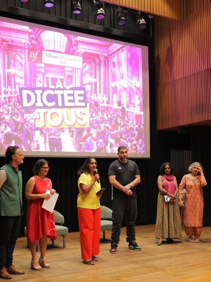 The organizing team and special guests on stage at the dictation event. Our cultural events are a result of strong collaboration and teamwork.