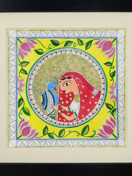 A woman in a traditional red veil holds a peacock in this beautiful Madhubani painting by Neha Kumari. The bright yellow background and floral border make this a warm and inviting piece of art.