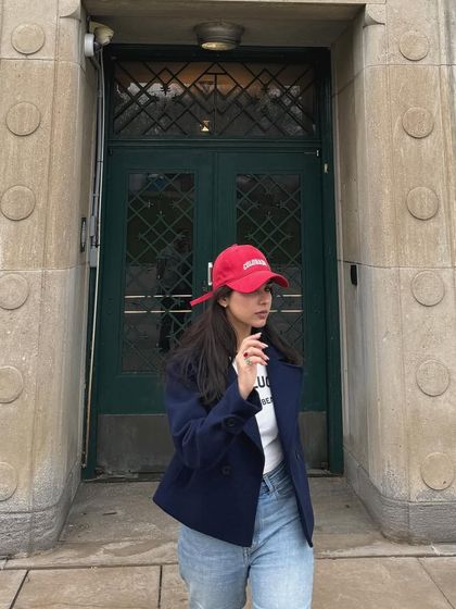 A close-up of the same casual weekend outfit, showing the details of the jacket and top.