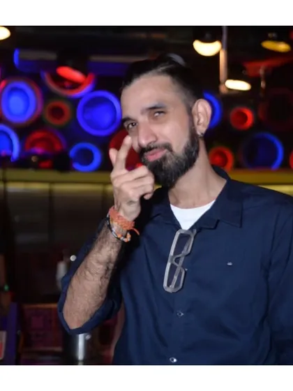 A confident shot with a cool pose. I bring a 'system' of good music and high energy that you have to be a part of.