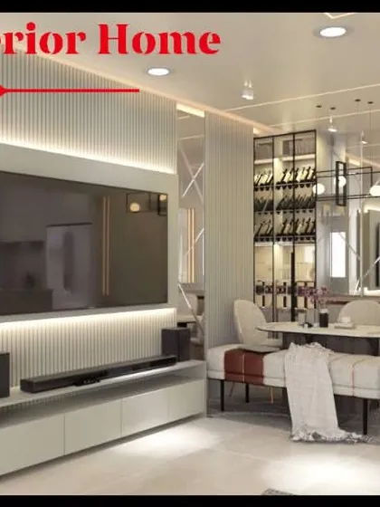 This bright and airy living room combines a minimalist TV unit with a comfortable dining space. The design uses white paneling, recessed lighting, and a neutral color palette to make the apartment feel spacious and modern.