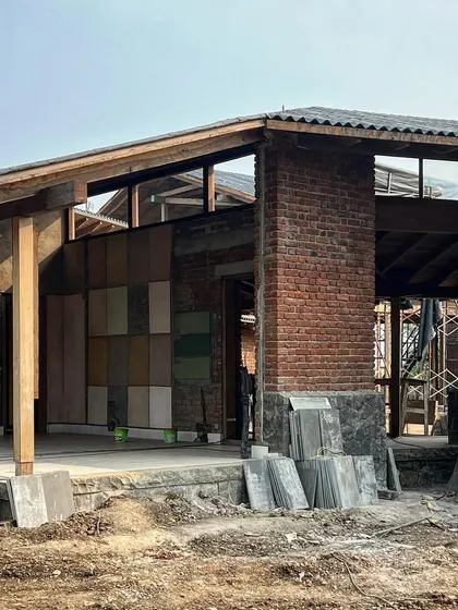 A wall of stone samples is tested against the brick facade of the farmhouse. We carefully consider how different materials will interact with each other and with the changing light throughout the day.