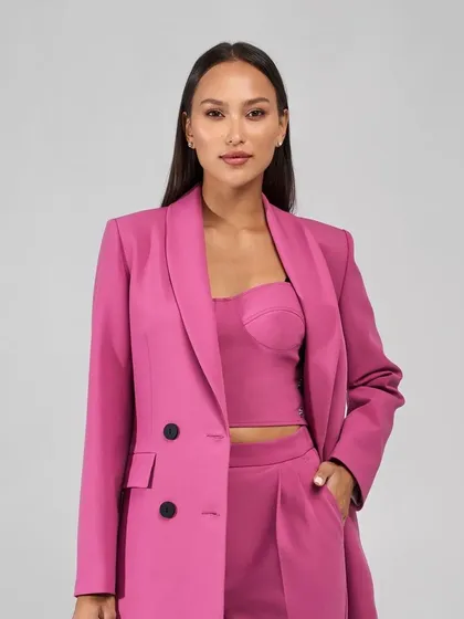This magenta suit can also be ordered as a three-piece set with a matching corset top, adding another layer of style and versatility.