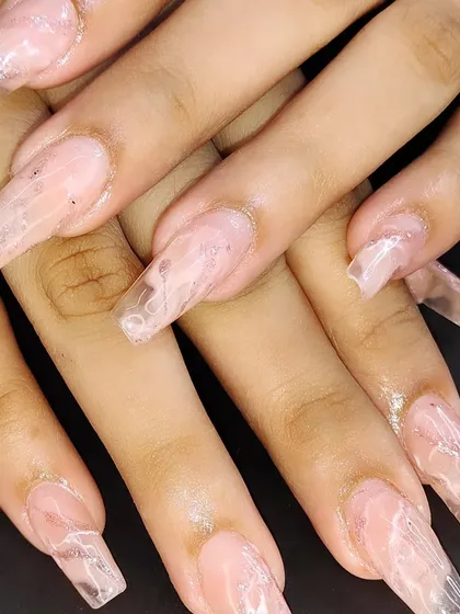 Another view of the long, clear acrylic marble nails.