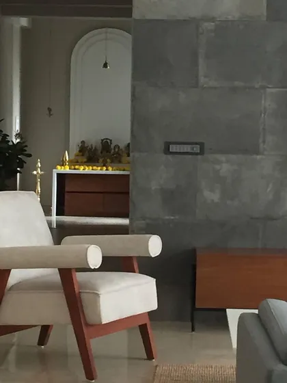A glimpse from the living area into the serene mandir space. This view highlights how we integrate distinct functional zones while maintaining a cohesive visual flow throughout the home.