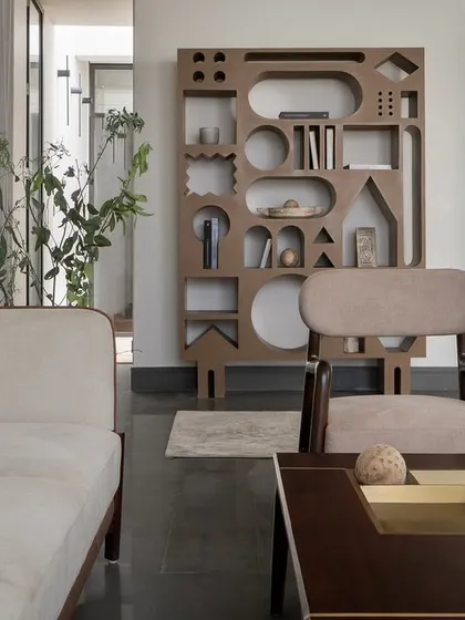 Even restraint can have character. In our compact Hikari House project, we designed this sculpted bookshelf from waste wood, turning leftover material into an interactive feature that brings a touch of whimsy and proves that resourcefulness can be expressive.