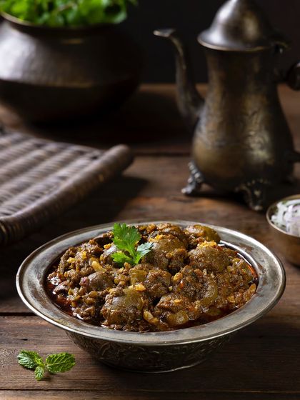 Gurda Fry, a classic dish, styled with antique-finish props for The Nawaab's to create a rustic and authentic feel.