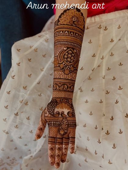 This elegant arm piece showcases my skill in creating intricate patterns, with peacocks and floral bands covering the arm.