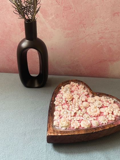 This heart-shaped candle is full of love and ready to be customized for you. You can choose the color, fragrance, and even the types of flowers to match your decor or gifting needs.