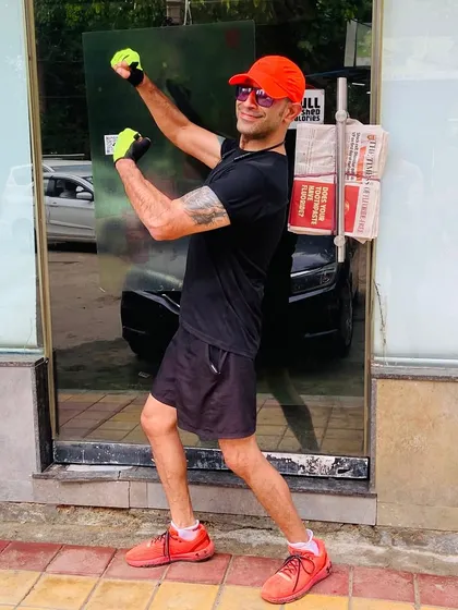 A member showing off his strength during a break. Our rides are a full-body workout, and we feel stronger every week.