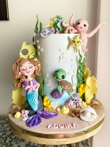 Dive into this magical underwater world I created for a little one's birthday. The cake features a hand-sculpted mermaid, a friendly turtle, a cheerful octopus, and other sea creatures. It’s a perfect example of how I can turn your child's favorite things into an enchanting, edible adventure.