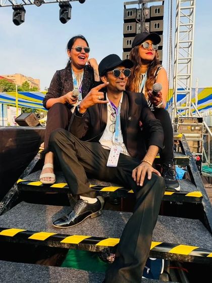 Some of our band members relaxing on the stage steps during the TCS World 10K event. Even during big shows, we find moments to enjoy the vibe.