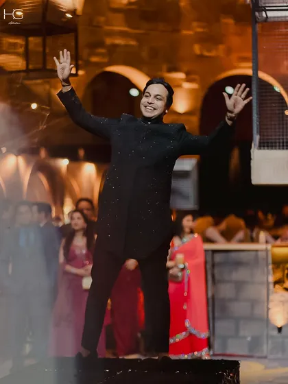 A moment of pure celebration. Piyush Bansal wears a custom black sherwani with subtle sparkle, designed to blend class and shine for his big day.