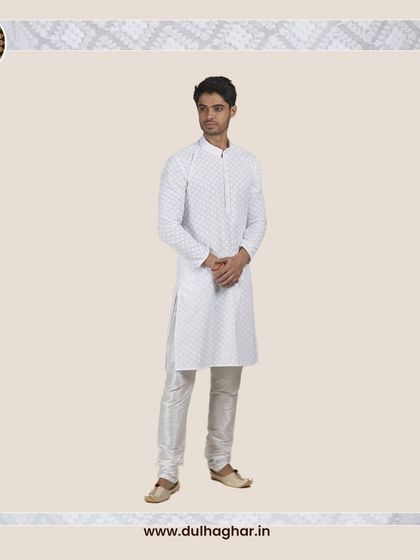 A classic white patterned kurta, a versatile and elegant choice for summer events.
