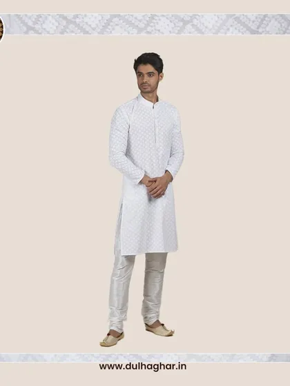 A classic white patterned kurta, a versatile and elegant choice for summer events.