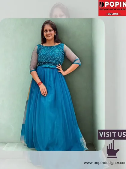 A full-length shot of the teal blue gown with a "Visit Us" call to action. It’s an invitation to come and try on this and other beautiful party dresses.