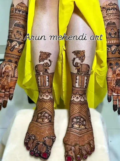 A royal-themed full bridal mehendi. The hands feature portraits and doli scenes, while the feet have matching elephant motifs.