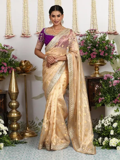 The full view of the ivory and purple saree, a soft and elegant look for any festive occasion.