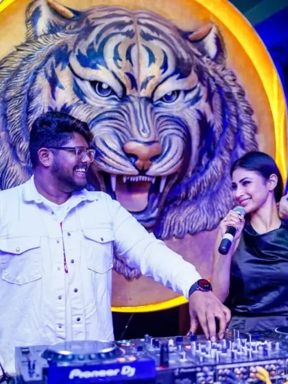 Sharing a laugh with Mouni Roy behind the DJ console. My ability to work alongside celebrities and hosts ensures a smooth and entertaining event for everyone involved.