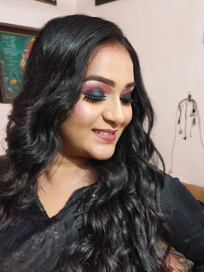 The client smiling, showing how the makeup looks natural and not heavy.