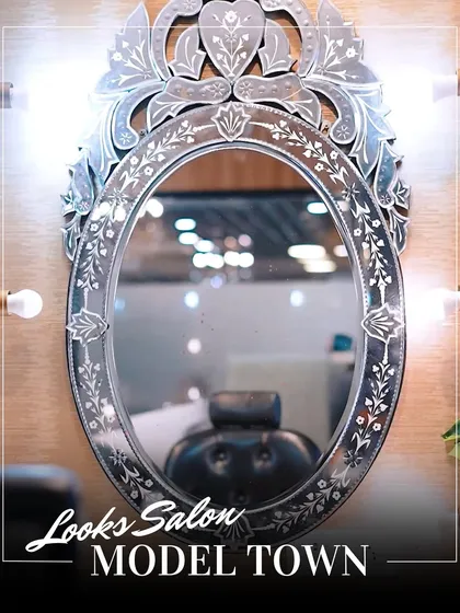 A close-up of the intricate design on our salon mirrors, reflecting our attention to detail and commitment to a luxurious client experience.