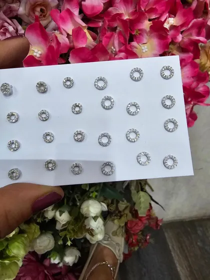 Simple and classic round halo studs in various sizes, a staple for any jewellery collection.