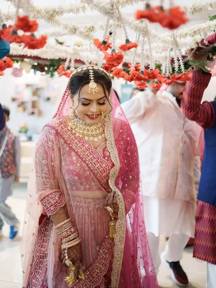 Another shot of the bride's entrance, capturing her happy and radiant expression.