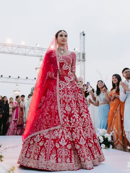 The bride's solo walk down the aisle. All eyes are on her, and her confident smile shows she feels as amazing as she looks.