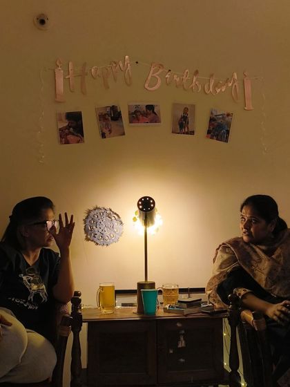 The cozy setup for a birthday celebration, with photos and warm lighting. My performances are designed to fit perfectly into these intimate, personal environments.