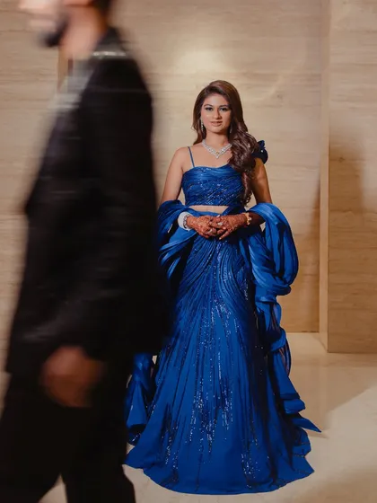 A different bride, also in a stunning blue Gaurav Gupta gown. This shows my versatility in creating unique glam looks for different clients.