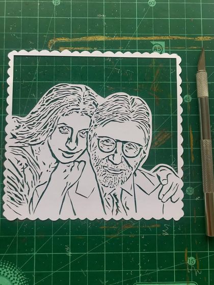 A work-in-progress shot of the Bachchan portrait on my cutting mat. I added a scalloped border to this piece to give it a classic, stamp-like feel.