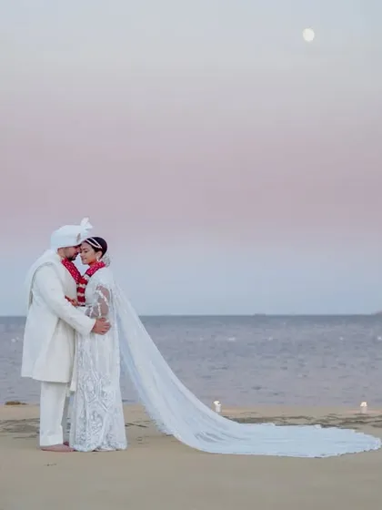 Under the moonlit sky on a beach in Malta, Sonali and Kenan share a quiet embrace. We chase the perfect light to create romantic, breathtaking portraits that feel both epic and intimate.