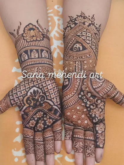 This design combines multiple traditional elements, with elephants on the wrist, a lotus cuff, and bold patterns on the palm.