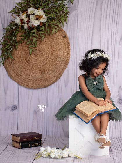 Let's start the day with a good read. This thoughtful portrait captures a quiet, beautiful moment of a little girl lost in her book.