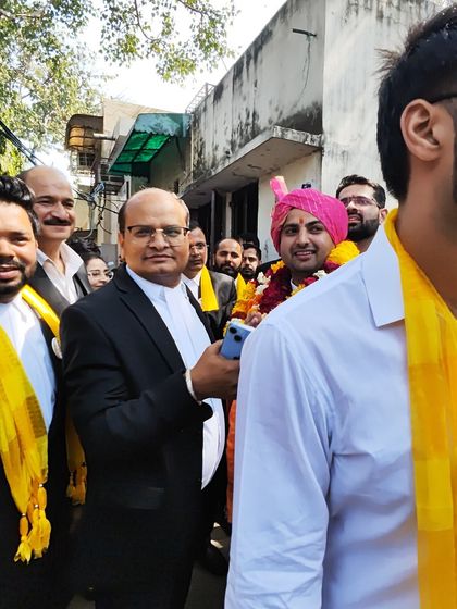 A candid moment from the campaign trail, surrounded by the vibrant energy of my supporters.