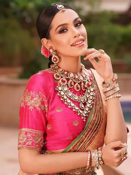 A close-up of the Indo-Western Kanjeevaram drape, showing how the pleats are arranged to create a unique and fashionable silhouette.