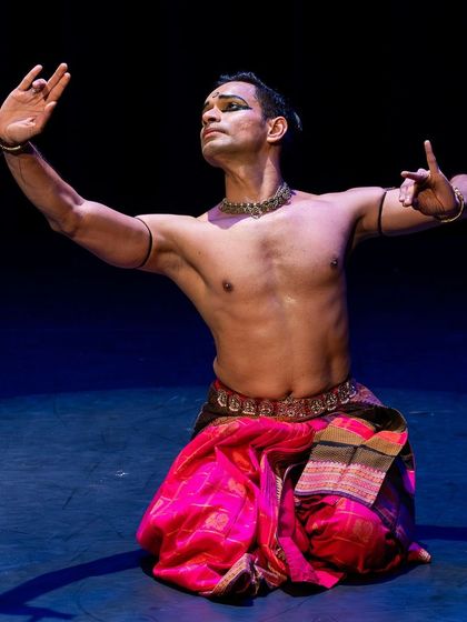 A seated pose from the same Canadian concert, showcasing the grace and control required in Bharatanatyam.